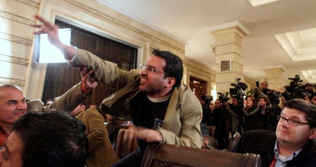 Iraqi journalist Muntadhar al-Zaidi throws a shoe at President George W. Bush